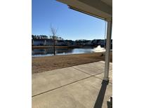 View from back porch, with a water feature and blue homes in the background at 204 Oak View Way, Summerville, SC 29483