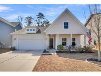 Charming white single-story home with a well-manicured lawn and a welcoming front porch at 3127 Safe Harbor Way, Charleston, SC 29414