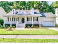 Charming home with a large front porch and a well-manicured lawn at 3537 Flowering Oak Way, Mount Pleasant, SC 29466
