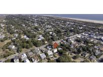 Charming coastal community featuring mature trees and various architectural styles near the beach at 406 Patriot St, Sullivans Island, SC 29482