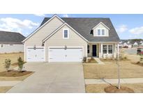 Charming home featuring a two car garage, landscaped front yard, and neutral siding at 1104 Jackrabbit Dr, Summerville, SC 29485