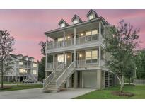 Stunning two-story coastal home with double balconies and a spacious driveway at 1308 Lieben Rd, Mount Pleasant, SC 29466