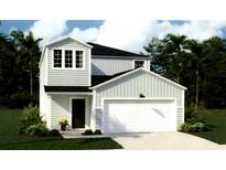Charming two-story home with a two-car garage and lush landscaping at 300 Pine Crest View Dr, Summerville, SC 29486