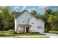 Charming two-story home with light blue siding, a covered porch, and an attached garage at 105 Pen Shell St, Summerville, SC 29485