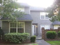 Traditional home with neutral siding, well maintained landscaping and a brick privacy wall at 114 Luden Dr # B, Summerville, SC 29483