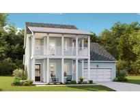 Charming two-story home with a covered porch, white pillars, and an attached garage at 230 Denham St, Summerville, SC 29486