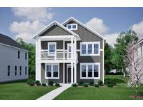 Charming two-story home with a covered porch, balcony, well-manicured lawn and beautiful landscaping at 230 O'Malley Dr, Summerville, SC 29483