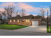 Charming brick home with a ramp leading to the front door and a one-car garage at 419 Oxford Rd, Ladson, SC 29456