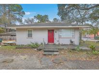 Charming single-story house featuring a red front door and a classic exterior at 635 Sequoia St, Charleston, SC 29407