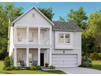 Charming two-story white home featuring a balcony, a well-maintained yard, and an attached one-car garage at 183 Belfort Pl, Summerville, SC 29486