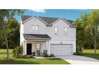 Charming two-story home with a covered front porch and well-maintained landscaping, plus a two-car garage at 617 Red Monarch Way, Moncks Corner, SC 29461