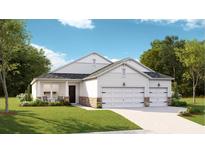 Charming single-story home featuring a three-car garage, stone accents, and a welcoming front porch at 1154 Darling St, Summerville, SC 29485