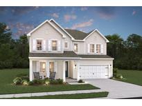 Charming two-story home with light siding, white trim, two-car garage, and inviting front porch with rocking chairs at 2010 Mcguire Ln # 003, Hollywood, SC 29449