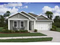 Charming home with a two-car garage, inviting porch, and well-manicured lawn at 2018 Mcguire Ln # 005, Hollywood, SC 29449