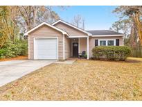 Charming single-story home with a well-maintained lawn and attached one-car garage at 536 Castle Hall Rd, Mount Pleasant, SC 29464