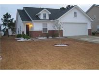 Charming one-story home with white siding, a dark roof, and a well-maintained lawn at 1303 Basketweaver Way, Hanahan, SC 29410