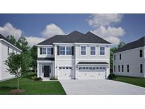 Charming two-story home featuring a two-car garage and a well-manicured front lawn at 156 Seaton Street, Summerville, SC 29486