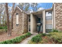 Charming condo building featuring brick and siding exterior with landscaped grounds and visible unit number at 1860 Montclair Dr # 1860-A, Mount Pleasant, SC 29464