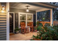 Inviting front porch with rocking chairs and tasteful decor offers a relaxing outdoor space at 1916 Gasque St, Johns Island, SC 29455