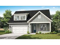 Charming single-Gathering home with a well-manicured lawn, attached garage and a pleasing grey facade at 2924 Lodge Berry Ln, Johns Island, SC 29455