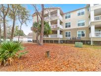 Condominium exterior shows well-maintained lawn space and a large building with private balconies at 700 Daniel Ellis Dr # 8107, Charleston, SC 29412