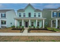 Charming two-story home with a welcoming front porch and attractive curb appeal at 219 Corvus St, Summerville, SC 29483