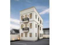 Charming three-story home with black framed windows and small balconies, showing off its unique and appealing architecture at 254 Saint Philip St # B, Charleston, SC 29403
