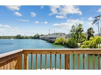 Balcony view of waterfront property with lush greenery and clear blue skies at 4993 Lake Palmetto, North Charleston, SC 29418