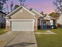 Charming single-Gathering home with a well-manicured lawn and two car garage at 632 Grassy Hill Rd, Summerville, SC 29483
