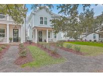 Charming two-story home with a landscaped front yard and inviting entrance at 1032 Avenue Of Oaks, Charleston, SC 29407