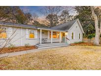 Charming single-story home with a cozy front porch and inviting curb appeal at 1706 W Avalon Cir, Charleston, SC 29407