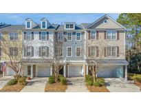 Charming townhomes featuring attached garages and well-maintained landscaping in a desirable community at 196 Fair Sailing Rd # 25, Mount Pleasant, SC 29466