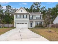 Charming two-story home with a two car garage and a well maintained yard at 150 Rockingham Way, Moncks Corner, SC 29461