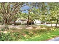 Charming single-story home featuring an ample front yard and mature trees at 317 Lankford St, Moncks Corner, SC 29461