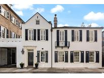 Charming home featuring classic architectural details and symmetrical design with black shutters at 35 Tradd St, Charleston, SC 29401