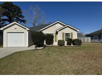 Charming single-story home with tan siding, green shutters, manicured landscaping and a one-car garage at 5082 Westview St, North Charleston, SC 29418