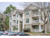 Charming condo building featuring multiple stories and private balconies at 700 Daniel Ellis Dr # 13302, Charleston, SC 29412