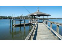 Waterfront home's private dock with gazebo boasts deep-water access and views at 8587 Middleton Point Ln, Edisto Island, SC 29438