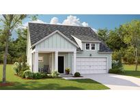 Charming single-Gathering home showcasing manicured lawn, inviting entrance, and attached garage for convenient parking and storage at 118 Threaded Fern St, Summerville, SC 29485