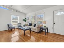 Bright living room featuring hardwood floors, lots of natural light, and modern furnishings at 1442 N Sherwood Drive Dr, Charleston, SC 29407