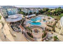Expansive resort pool area with multiple pools, fire pit, and ocean views at 5800 Palmetto Dr # Vg-105, Isle of Palms, SC 29451