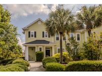 Charming two-story home with lush landscaping and a welcoming front porch at 1225 Blakeway St # 701, Charleston, SC 29492