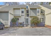 Charming townhome featuring a well maintained facade, complemented by mature landscaping and convenient parking at 2765 Jobee Dr # 1304, Charleston, SC 29414
