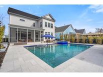 A stunning backyard with a pool, hot tub, screened porch and a paver deck, perfect for entertaining or relaxing at 2942 Clearwater Dr, Mount Pleasant, SC 29466