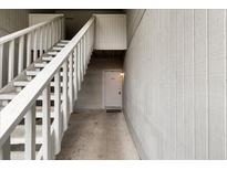 Exterior entryway featuring staircase and unit 402's door, painted in white at 402 Greencastle Dr, Goose Creek, SC 29445