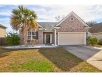 Charming single-story brick home features an attached garage and a well-maintained front yard with a mature palm tree at 7836 Lumberton Rd, North Charleston, SC 29418