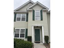 Charming front entrance featuring a dark green door with sidelights, complemented by manicured landscaping for added curb appeal at 1545 Ashley River Rd # 3K, Charleston, SC 29407