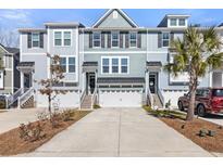 Charming multi-level townhome with attached garages and well-manicured landscaping at 1549 Moss Spring Rd, Mount Pleasant, SC 29466