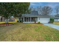 Charming single-story home with a landscaped front yard, mature tree, and a screened-in porch at 240 Horseshoe Dr, Goose Creek, SC 29445