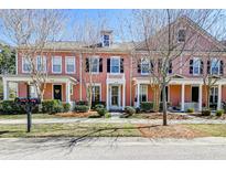 Charming townhomes with landscaped front yards and inviting covered entryways at 2428 Kings Gate Ln # 502, Mount Pleasant, SC 29466
